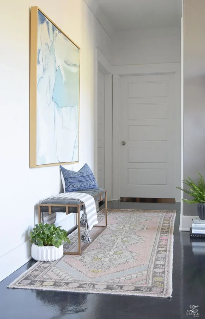 simple entryway rug styling ideas: Layering for Texture and Interest